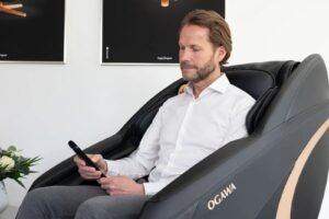 Man with white shirt in massage chair in office