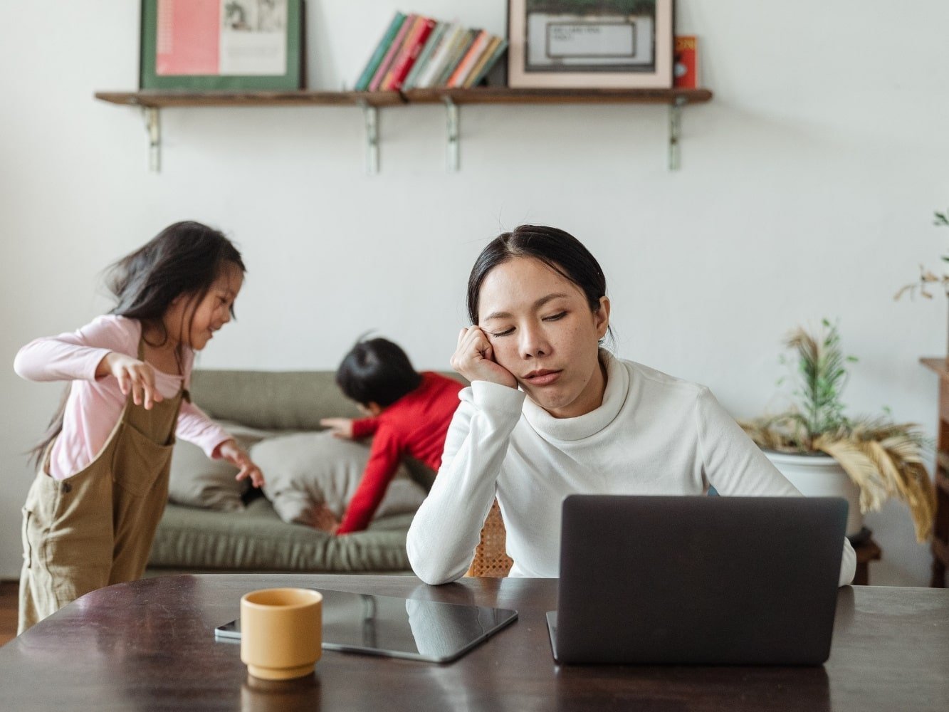 woman behind computer with overtiredness